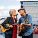 After a lifetime of protest songs and quiet resistance, Joan Baez walked onto the Washington stadium stage — but this time, not alone. As James Taylor appeared beside her, the crowd held its breath. What followed wasn’t just a duet — it was a spiritual reunion, decades in the making. Their voices, weathered yet luminous, wrapped around each other like old friends rediscovering magic. And when they sang the final note of “You’ve Got a Friend,” even the security guards had tears in their eyes