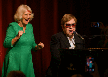 At a star-studded charity event, Camilla stole the spotlight in the most unexpected way as Elton John performed his iconic hit “Crocodile Rock.” Eyewitnesses say the moment the music started, she couldn’t resist standing up, dancing, and singing along with infectious energy. Fans whipped out their phones, capturing the unexpected royal display, and clips quickly went viral across social media. Sources reveal Elton was both amused and impressed, sharing smiles and playful nods with the Duchess. Insider accounts hint that the lighthearted scene sparked laughter throughout the venue, making it one of the most talked-about moments of the evening. The royal’s spontaneous enthusiasm melted hearts, proving even royalty can’t resist the power of classic rock. By the end, the event was buzzing not just for charity, but for the unforgettable royal jam session.
