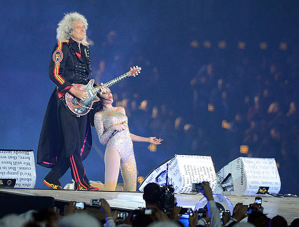 Queen guitarist Brian May and Jessie J perform "We Will Rock You" at the Olympic Stadium in London, England, during the Closing Ceremony for the...